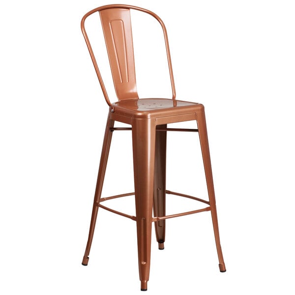 A brown metal outdoor bar stool with a copper seat and back with vertical slats and a drain hole.