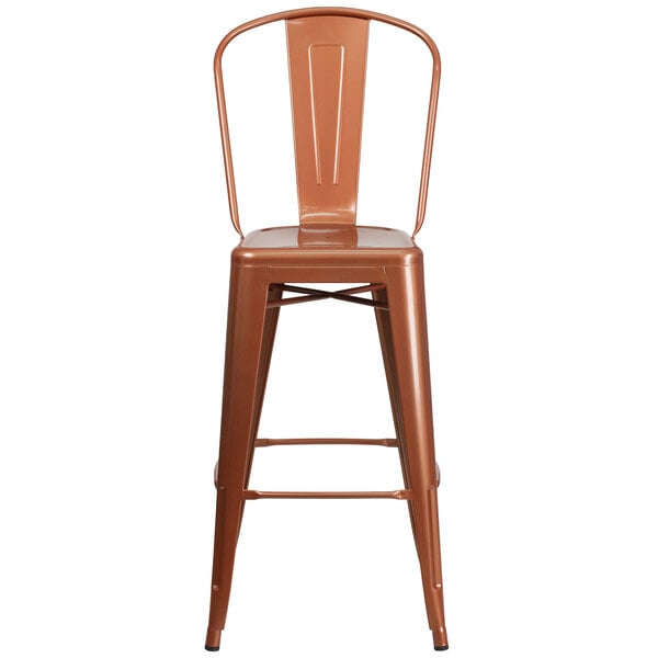 A copper metal bar stool with a slatted back and drain hole seat.