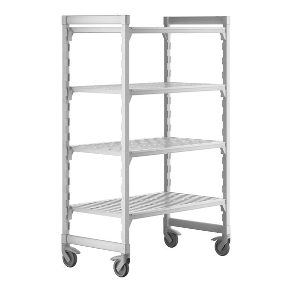 A white metal Cambro Camshelving Premium mobile shelving unit with four shelves.
