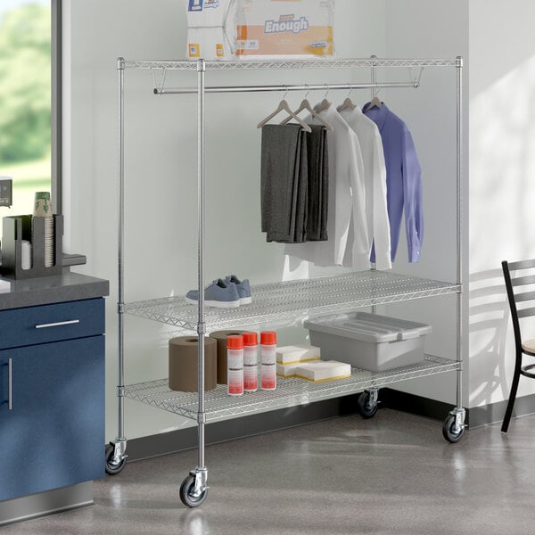 A Regency chrome wire garment rack with clothes and items on it.