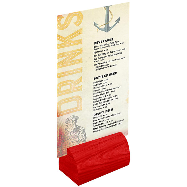 A Menu Solutions curved berry wood card holder on a table with a menu card in it.