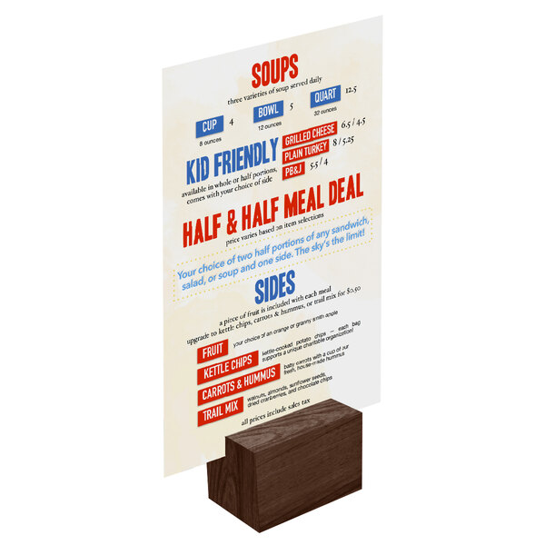 A Menu Solutions walnut wood rectangular table card holder with a menu on it.