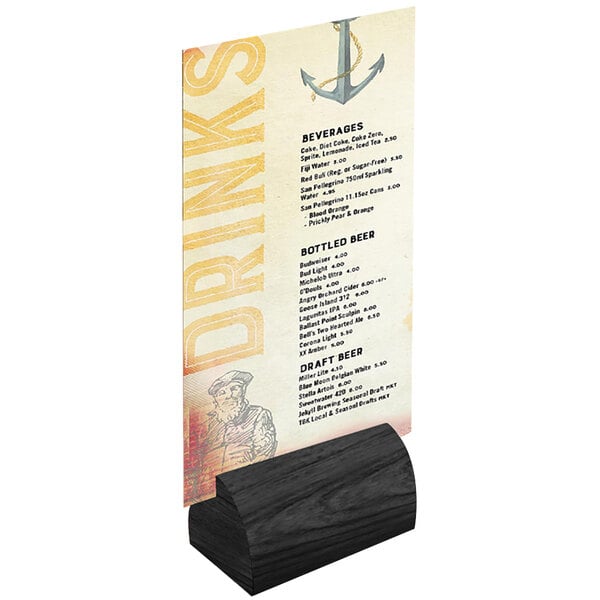 A black wood curved Menu Solutions card holder on a table with a menu card in it.