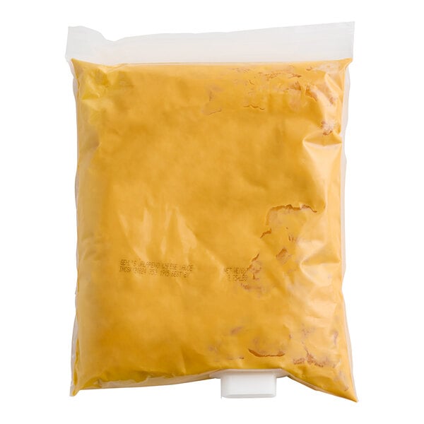 A yellow plastic bag of Gehl's jalapeno cheese sauce.