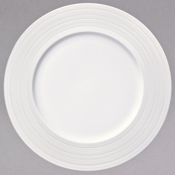 A white Oneida porcelain plate with a thin circular rim.