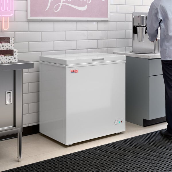 A white Galaxy CF5 commercial chest freezer with a 5.2 cubic foot capacity.