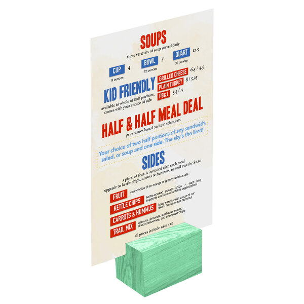 A teal wooden block holding a rectangular card with a white sign.