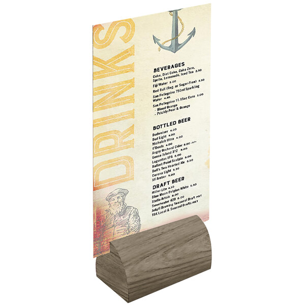A weathered walnut wood curved card holder on a table with a menu card.