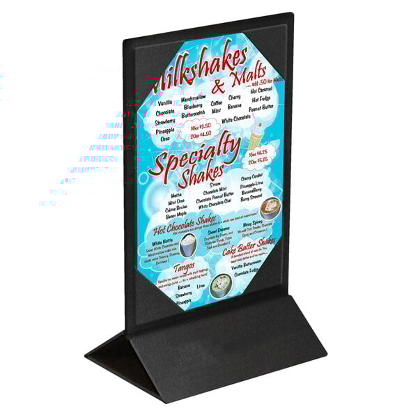A black Menu Solutions table tent with picture corners holding a menu on a stand.