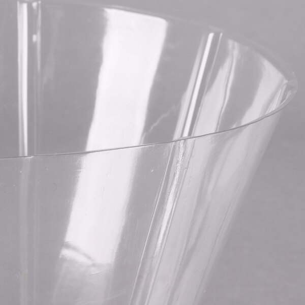 A clear plastic liner with a curved edge inside a metal basket.