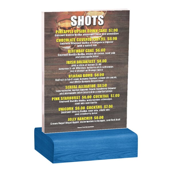 A clear acrylic table tent with a printed menu, held upright by a solid true blue wood base.