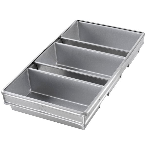 A silver rectangular metal loaf pan with three compartments.