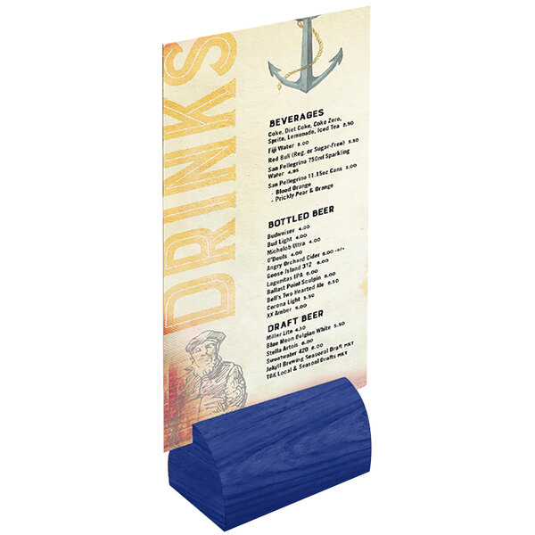 A Menu Solutions curved blue wood block holding a menu on a table.