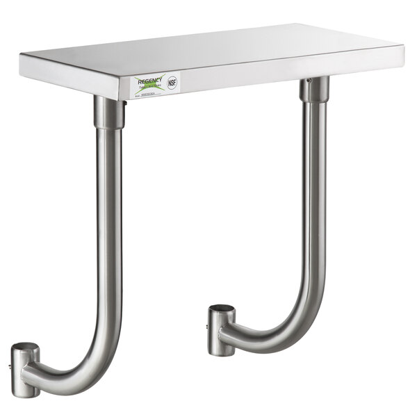 A Regency stainless steel adjustable work surface on a metal shelf with two metal pipes.