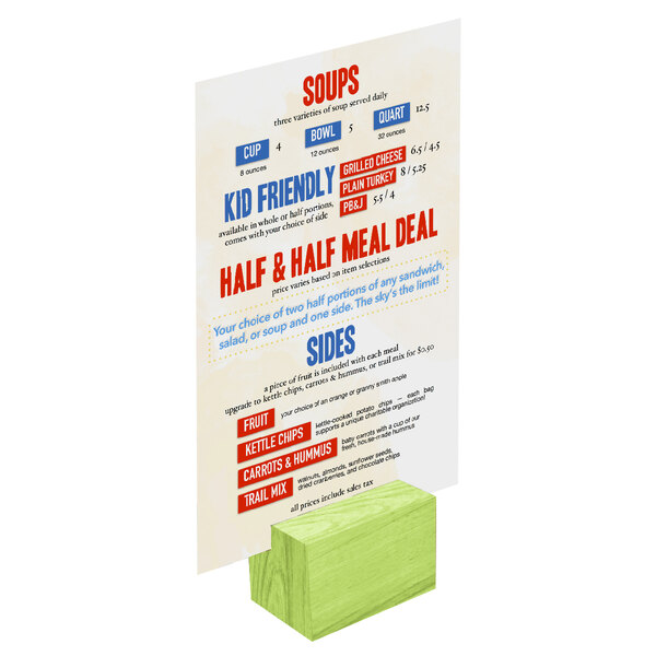 A Menu Solutions lime wood rectangular card holder on a table holding a restaurant menu.