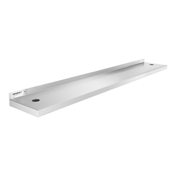 A long, rectangular stainless steel shelf with a raised back edge and two circular holes, viewed at an angle.