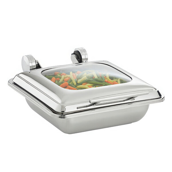A Vollrath stainless steel chafing dish with a glass lid containing food.