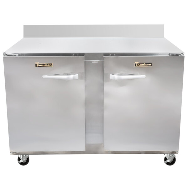 A large Traulsen stainless steel worktop refrigerator with two doors and two drawers.