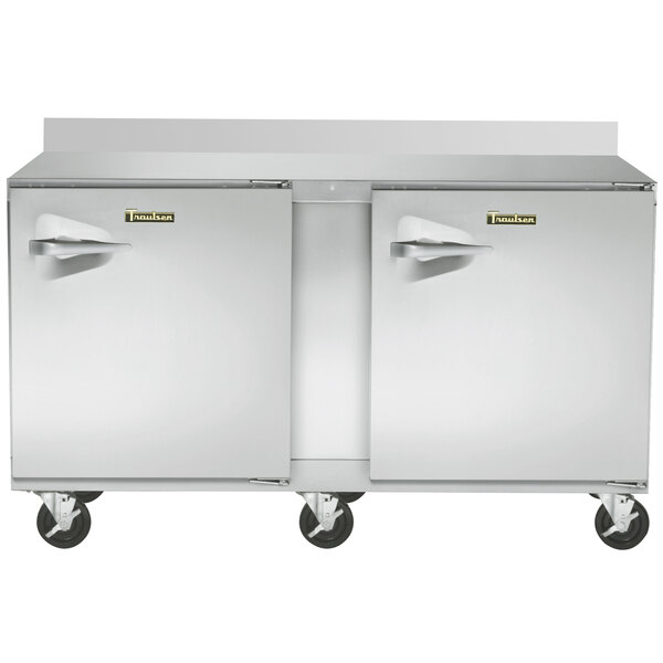 A Traulsen stainless steel worktop freezer with two doors.