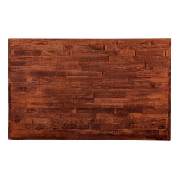 A rectangular wooden table top with a mahogany finish.