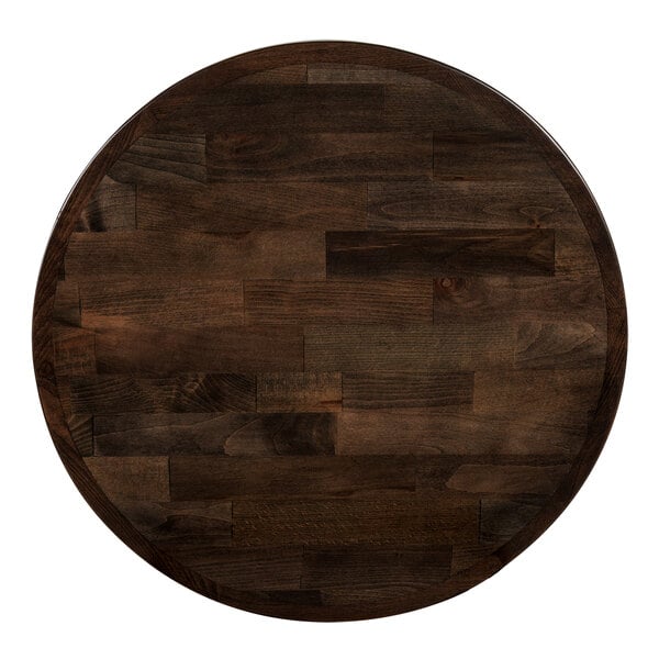 A Lancaster Table & Seating round wooden table top with espresso finish.