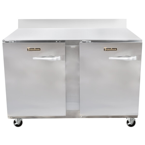 A Traulsen stainless steel worktop refrigerator with two doors and two drawers.