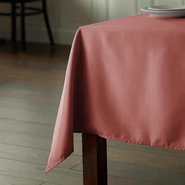 a table with a pink cloth