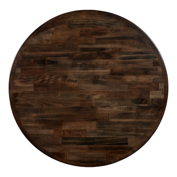 A Lancaster Table & Seating round wood table top with an espresso finish.