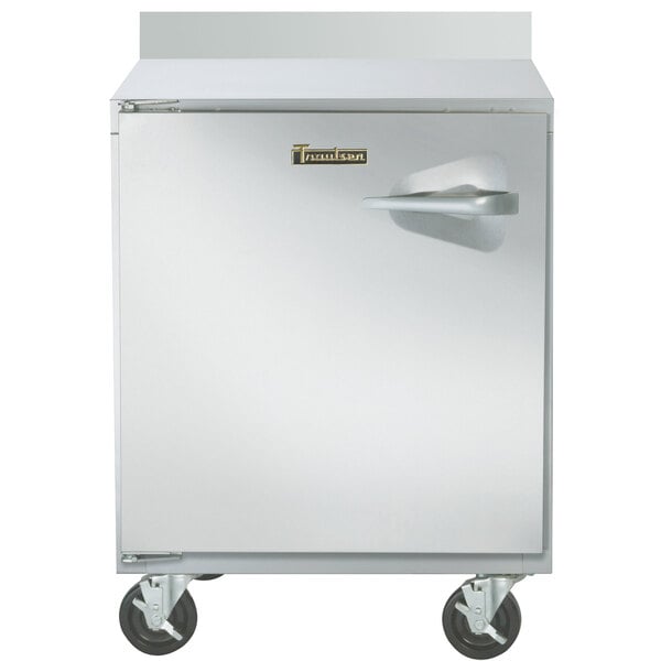 A Traulsen 27" worktop freezer with a door and wheels.