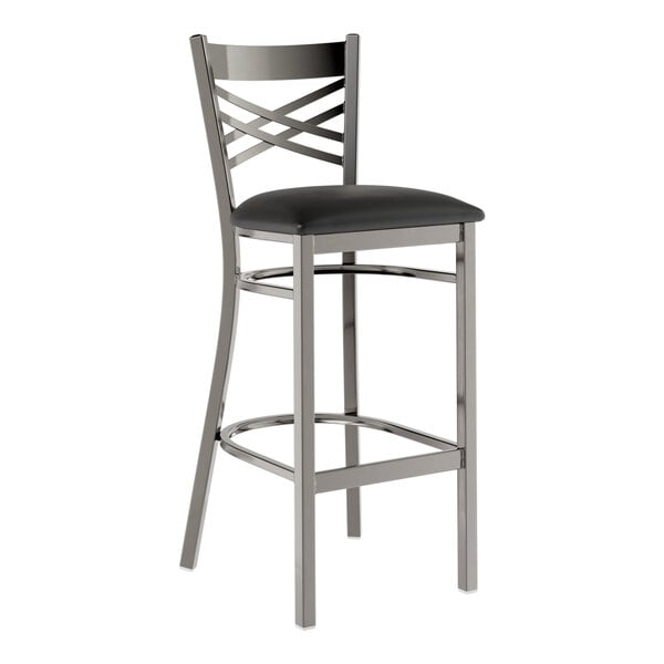 A Lancaster Table & Seating clear coat finish cross back bar stool with a black vinyl padded seat detached.