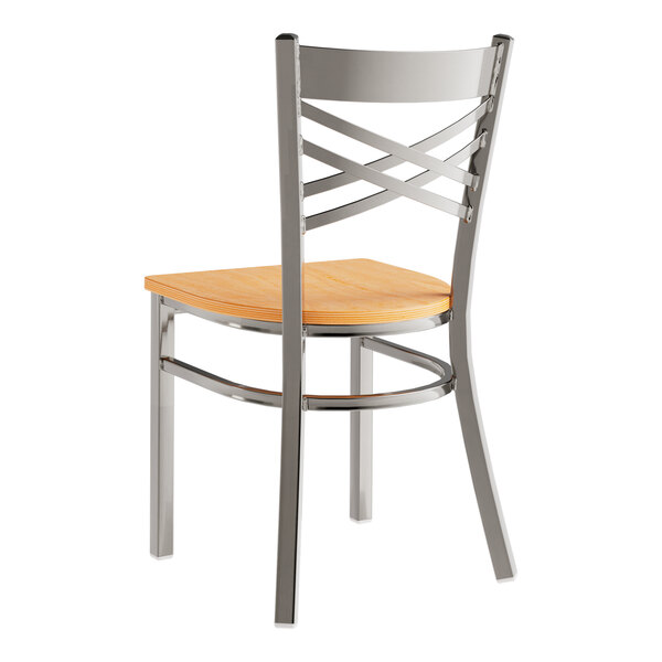 A Lancaster Table & Seating metal chair with a natural wood seat and back.