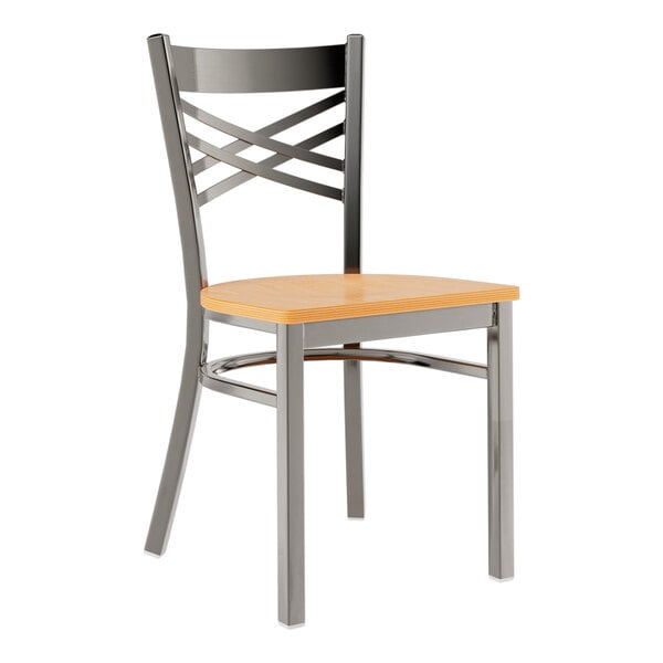 A Lancaster Table & Seating metal cross back chair with a natural wood seat.