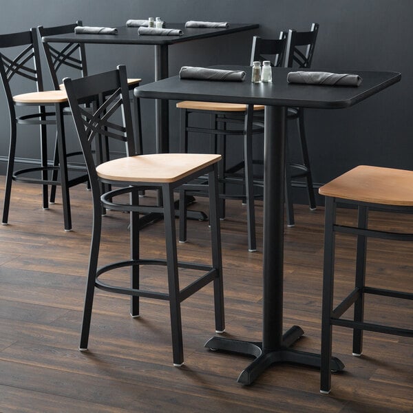 A black finish cross back bar stool with a natural wood seat and a detached seat design.