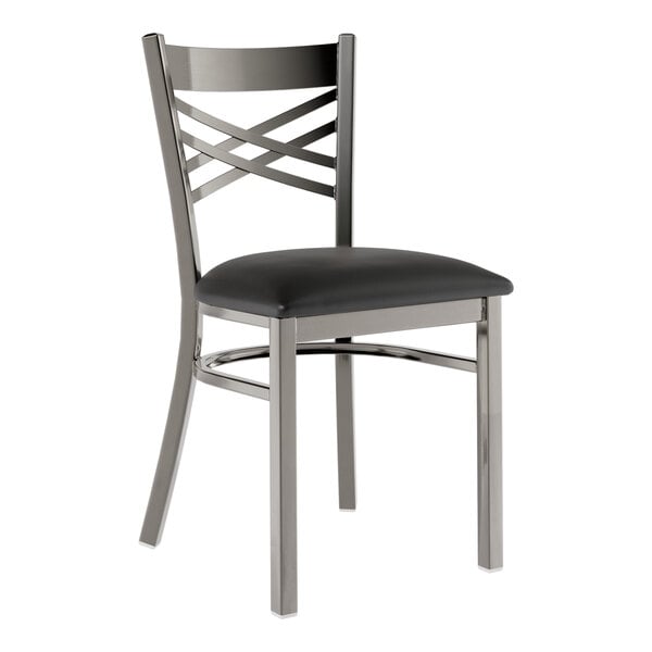 A Lancaster Table & Seating black metal cross back chair with a black padded seat.