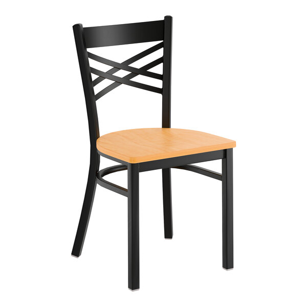 A black metal cross back chair with a natural wood seat.