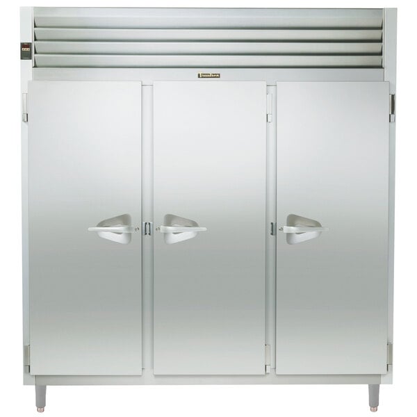 A Traulsen stainless steel reach-in heated holding cabinet with three doors open.