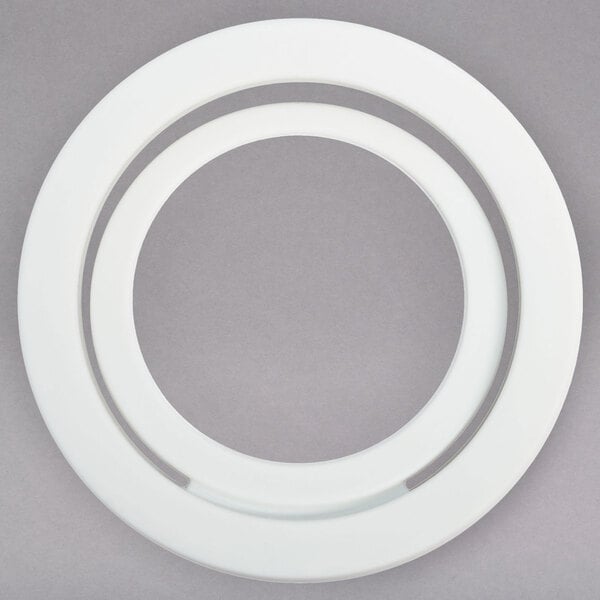 A white circular head gasket with a hole in the center.