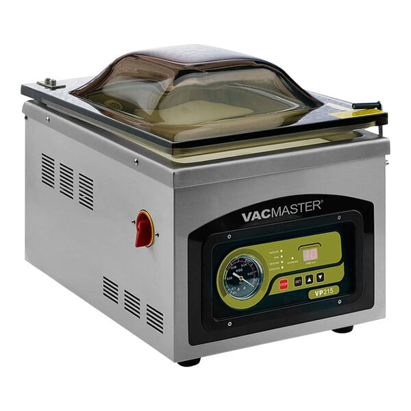 An ARY VacMaster chamber vacuum packaging machine with a glass lid on a kitchen counter.