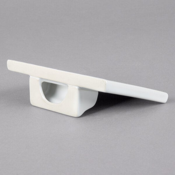 A white rectangular ceramic card sign with a gray border.