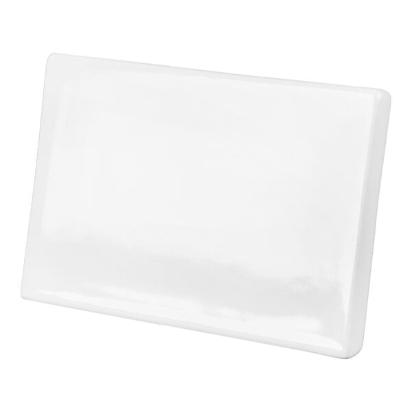 A rectangular, glossy white ceramic object with slightly rounded edges, photographed against a white background.