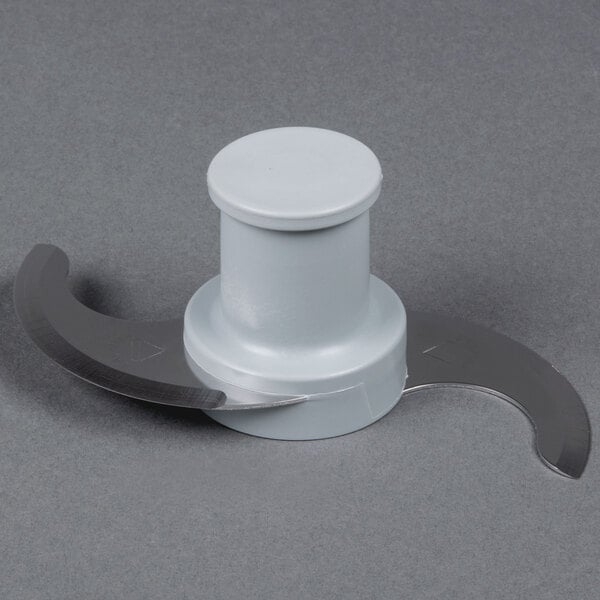 A white plastic food processor bowl with a round top.