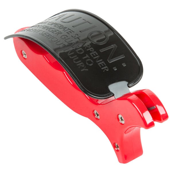 A red and black Chef Master carbide knife sharpener with a metal handle.