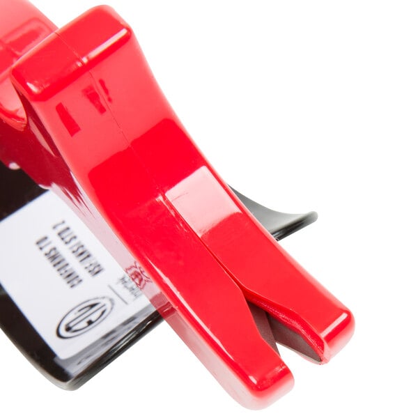 A red plastic clip on a black Chef Master knife sharpener.