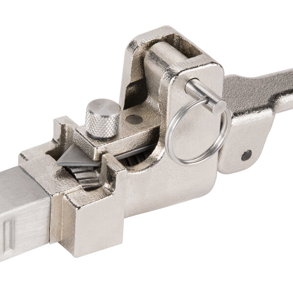 An Edlund Standard Duty Manual Can Opener with a metal clamp and key on it.