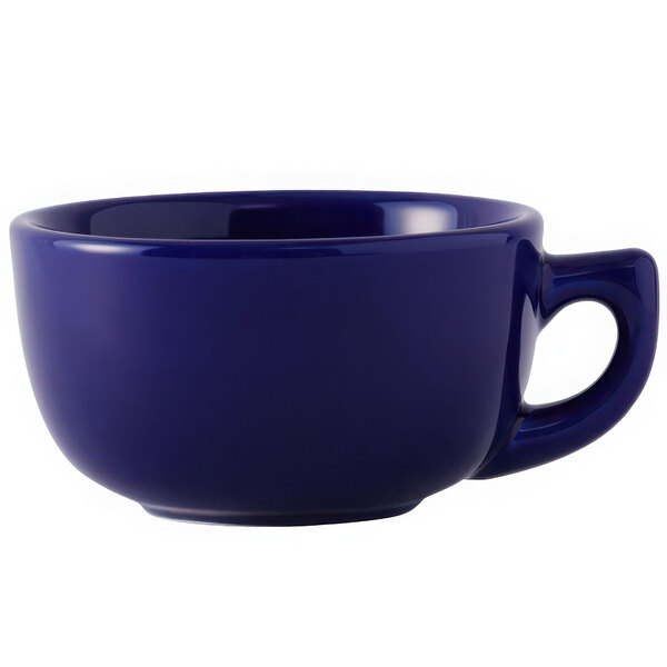 A blue Tuxton cappuccino cup with a handle.