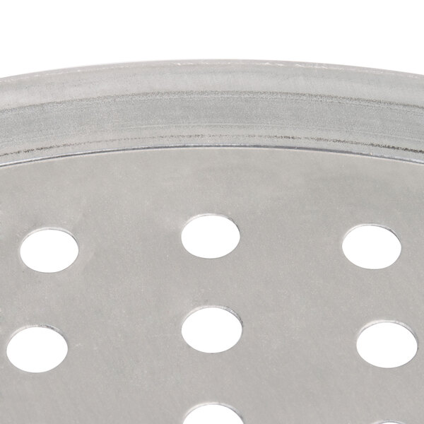 An American Metalcraft tin-plated steel pizza pan with holes in it.