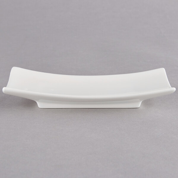 A white rectangular Arcoroc porcelain plate with a long, thin edge.