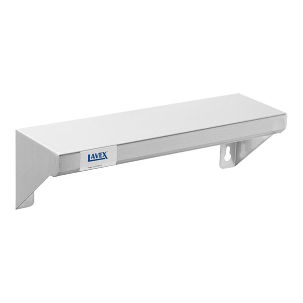 A white box with a label for a Lavex stainless steel wall mount shelf.