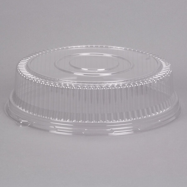 A clear plastic round high dome lid for a container.