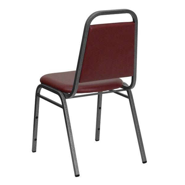 A red Flash Furniture banquet chair with a metal frame.